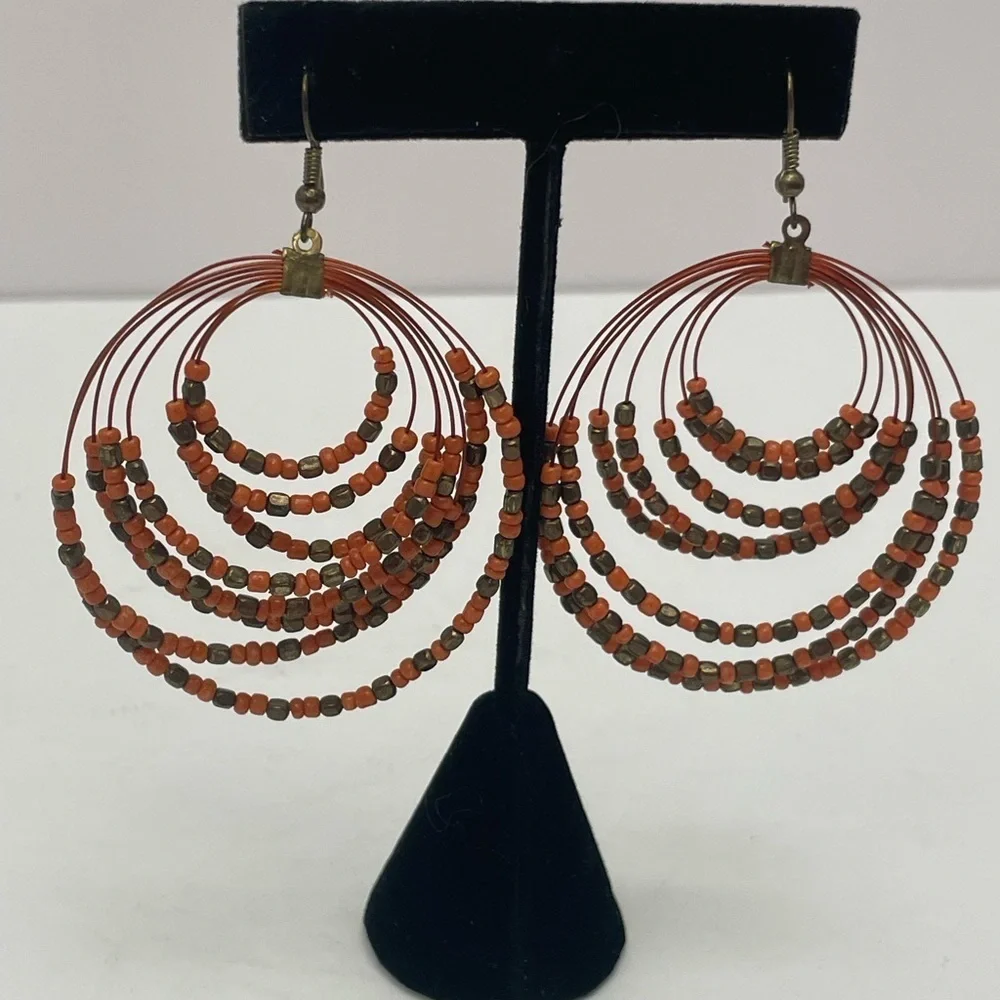 Coral and copper bead multi strand round drop earrings.